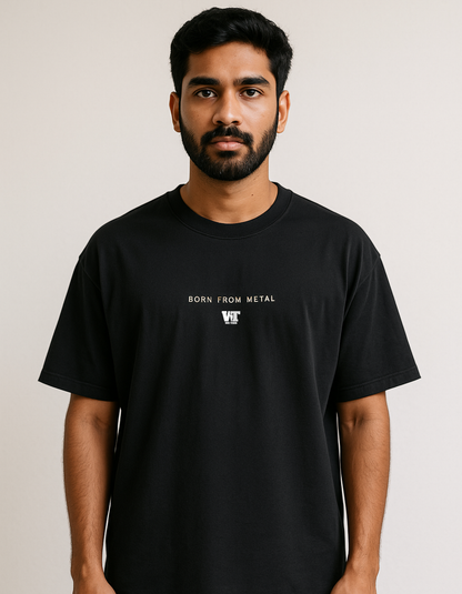 Black oversized T-shirt with small minimal ‘Born From Metal’ text on the front.
